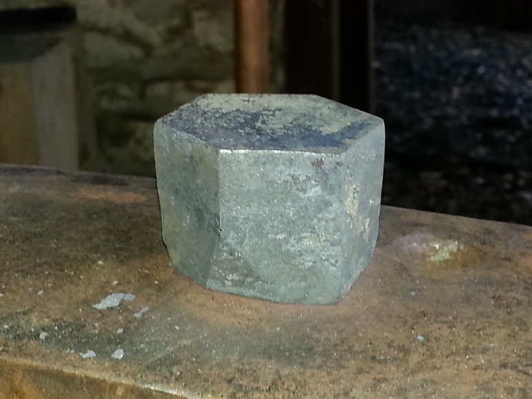 Side view of the edge tool in place on the small anvil.